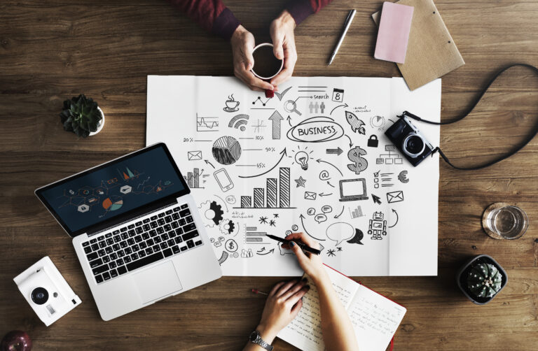 Map and marketing materials on a wooden table